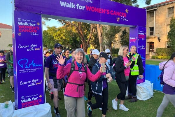 People in pink tshirts walk through the start for the New Town Toyota Walk for Womens Cancer in Perth on 29 April 2023