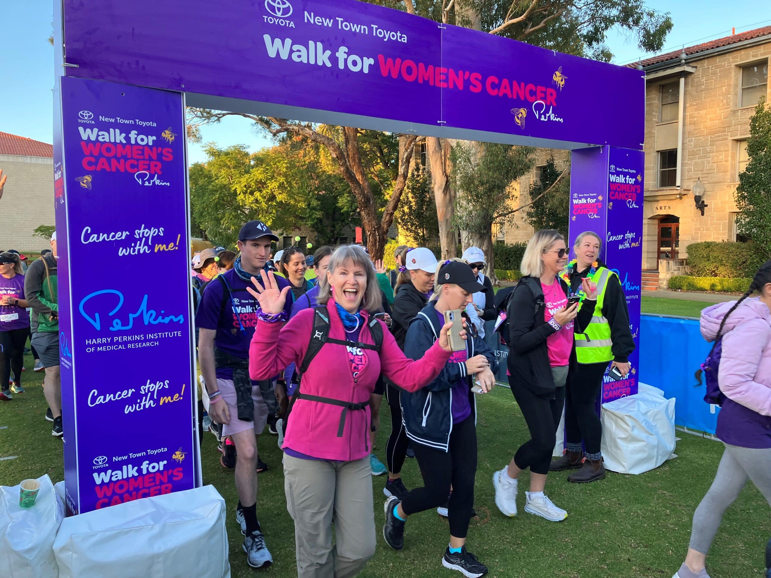 People in pink tshirts walk through the start for the New Town Toyota Walk for Womens Cancer in Perth on 29 April 2023