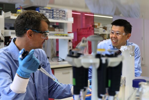 Perkins researchers Prof Jonas Nilsson and Dr Peter Lau at lab bench with equipment