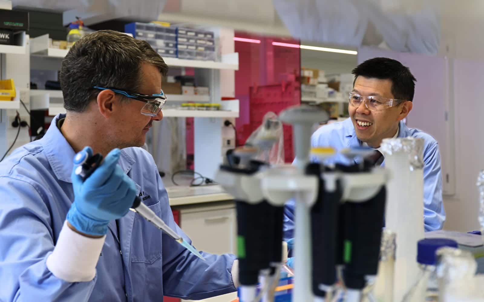 Perkins researchers Prof Jonas Nilsson and Dr Peter Lau at lab bench with equipment
